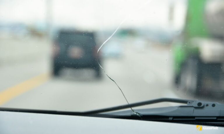 What causes hairline crack in windshield